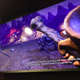 A trailer for Dragon Quest VR, with in-game imagery, is shown at the Shinjuku VR Zone where players wait to try the game.